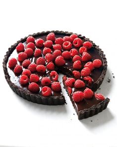 a chocolate tart with raspberries on top