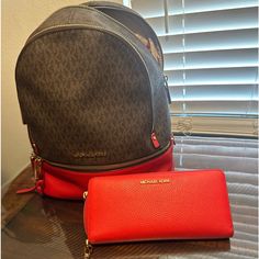 Brown With Red Back Bag And Red Wallet Michael Kors Red Bag With Removable Pouch, Michael Kors Red Bag With Handles, Red Wallets With Removable Pouch, Michael Kors Brown Leather Wallet, Brown With Red, Brown Michael Kors Wallet With Zipper Closure, Red Wallet, Mk Purse, Back Bag