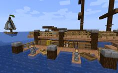 a pirate ship floating in the ocean next to some rocks and wood planks with lights on them