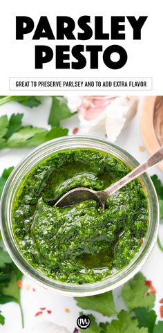 the cover of parsley pesto is shown in a glass jar with a spoon