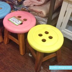 three stools with buttons on them sitting in front of some food and other items