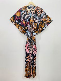 This Beautiful Indian Cotton Caftan or can be called as Tunic is made with super fine quality cotton and designs have been crafted by Hand Prints. Measurements :- Size - Free Size Length -138 Cm / 54 Inches Bust/chest size - 87 CM/ 34 Inches Fabric - 100% Cotton Pattern - Floral Kaftan has Adjustable Drawstring Waist to loose or tight , Kaftan has V Shape Neck Which is 8" Inches Deep. Kaftan Is Multi-purposeand can be worn as a cover up at the Beach ,Lounge wear ,sleepwear ,Pregnant Women Hospit Festive Printed V-neck Kaftan, Festive Floor-length Floral Print Kaftan, Silk Kaftan With Floral Print And V-neck, Luxury V-neck Floral Embroidered Kaftan, Multicolor Printed V-neck Kaftan, Cotton Caftan, Beach Lounge, Silk Kimono Robe, Hospital Gown