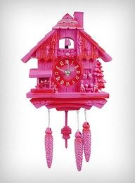 a pink cuckoo clock with red decorations on it's face and hands, in front of a white background