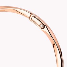 Sleek and stackable, this dynamic, twisting rose gold Spiral bangle performs playful pirouettes as it swirls elegantly around the wrist. Delicate enough to wear every day, wear it alone or pair with other Spiral bangles, amplifying the impact of these eternally modern jewels. The Spiral collection features delicate gold and pavé diamond jewels that are designed to be stacked and mixed and matched, alongside a range of captivating timepieces. A charming Spiral rose gold bangle featuring a total w Modern Twist Bangle With Polished Finish, Modern Rose Gold Bangle, Modern Rose Gold Round Bangle, Elegant Rose Gold Bangle With Polished Finish, Elegant Polished Rose Gold Bangle, Diamond Shaped Engagement Ring, Graff Diamonds, Rose Gold Bangle, Bangle Watches