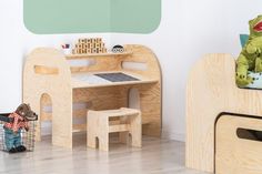 a child's desk and chair in a play room