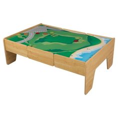 a child's wooden table with a green and blue design