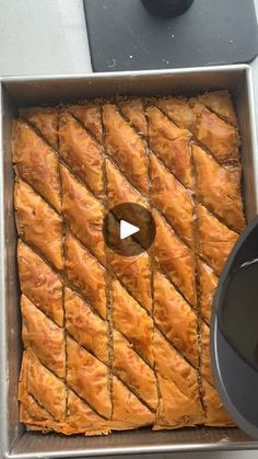 a pan filled with pastry sitting on top of a counter