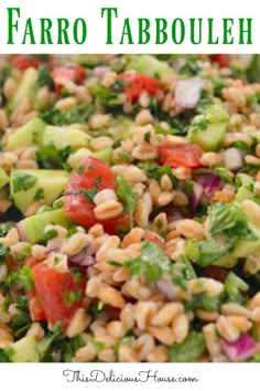 a salad with faro tabbouleh, tomatoes, cucumbers and other veggies