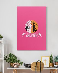 a pink poster on the wall above a desk