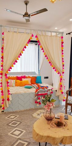 a living room filled with lots of furniture and decor on top of a wooden table