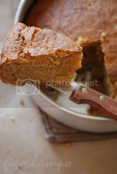 a piece of cake being lifted from a pan