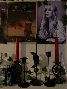 there are candles and pictures on the wall