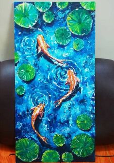 a painting of two koi fish swimming in lily pads