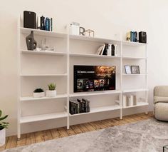 a living room filled with furniture and a flat screen tv mounted on a white wall