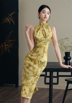 Yellow Fitted Halter Dress, Fitted Sleeveless Summer Cheongsam, Summer Formal Cheongsam With Stand Collar, Summer Party Cheongsam With Stand Collar, Elegant Yellow Halter Neck Dress, Fitted Sleeveless Spring Cheongsam, Fitted Sleeveless Ao Dai For Spring, Yellow Fitted Ao Dai For Wedding, Modern Qipao