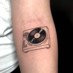 a tattoo with a record player on it