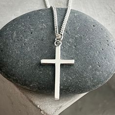 "Great Masculine Simplicity in this piece...Great Father's Day Gift or gift for any man in your life. ~Simple, understated sleek solid sterling silver cross ~Cross is approx 1.25\" long x 1/2\" wide.  ~Suspended on sturdy Sterling silver curb chain ~Sterling silver swivel lobster clasp  ~Please be sure to select length from drop down options ~All metal components are solid Sterling silver Please visit my shop for more great jewelry finds: ChrisKateJewelry.etsy.com Current Processing Times All of