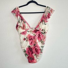 Has A Floral Pattern And Slight Ruffled Top With A V Neckline And Subtle Ruching Feminine White Bodysuit For The Beach, Beachwear Floral Print V-neck Bodysuit, Aerie Bathing Suits, Underwire Swimwear, Brown One Piece, High Neck Tankini Top, Tropical Swimsuits, High Neck Tankini, Maternity Swim