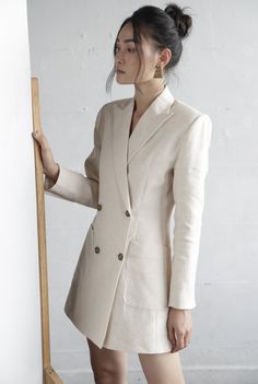 Beige Long Sleeve Suits For Fall, Beige Long Sleeve Suits For Spring, Spring Beige Suits With Buttons, Neutral Long Sleeve Blazer With Buttons, Neutral Long Sleeve Blazer With Button Closure, Beige Long Sleeve Blazer With Double Button Closure, Fitted Neutral Outerwear With Pockets, Neutral Long Sleeve Blazer With Pockets, Women Office Wear