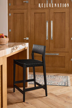 a black chair sitting on top of a wooden counter