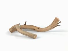 two pieces of driftwood on a white background