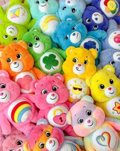 there are many different colored teddy bears together