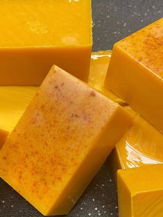 several pieces of yellow soap sitting on top of a table