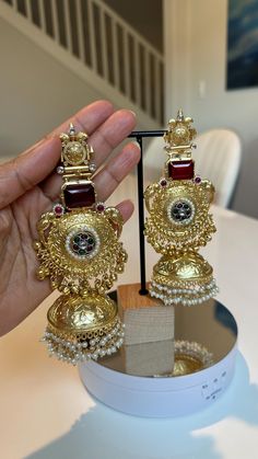 A Trending showstopper long Jhumka earrings in golden, simply wear these dangler Jhumka and you're all sorted. These are enhanced with delicate Pearls, Monalisa stones in Yellow/Blue/Deep Red. This is a perfect earring for Party wear, Indian Weddings, Diwali, Birthdays, Anniversaries. A  great gifting idea to loved ones!  Color : Golden, Yellow, Blue, deep Red length : 5.5 inch width : 2.4 inch Each earring Weight : 57 grams Material : 92.5 golden polish on Brass, monalisa stone, pearls Beautiful High Quality, premium jewelry. * Free US standard shipping. 1. You will get the exact product same as picture. 2. There will be slight color variation due to technical limits of photography. 3. This is high quality earrings with high lustered polish for long lasting finish.  4. Please expect the p Long Jhumka Earrings, Golden Jhumka, Earring Trends, Party Kleidung, Indian Weddings, Jhumka Earrings, Buy Handmade, Deep Red, Yellow Blue