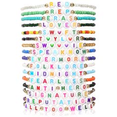 an assortment of bracelets with words written on them in different colors and sizes, all stacked together