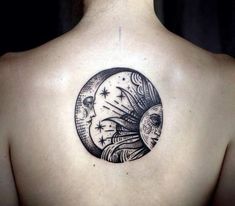 a woman with a tattoo on her back is looking at the moon and stars in the sky