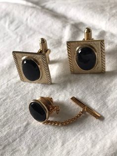 3 pc. Set from the mid 1960's stamped Hayward inside the cufflinks. Black onyx center stone set in a gold tone metal alloy. In good vintage condition. Feel free to convo me with any further questions. Thank you for your interest. Classic Gold Cufflinks For Party, Antique Cufflinks For Business, Antique Cufflinks For Formal Wear, Vintage Picnic, Music Box Jewelry, French Cuff, Cuff Jewelry, Vintage Cufflinks, Sewing Items