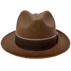 Original Panama Hat. Introducing a beautiful short-brimmed fedora style Panama with a fairly deep slit. Of a dark brown color with its bicolor band of brown tones and a splendid bow to finish giving the classic and modern touch at the same time. For casual and bohemian occasions with great style. TOQUILLA STRAW HAT, HANDMADE IN ECUADOR. WEAVE: LLANO FINE CUENCA HAT GRADE: 7 BRIM: 2 CROWN: 4,5 Fedora Style, Grade 7, Hat Handmade, Beautiful Shorts, Dark Brown Color, Brown Tones, Straw Hat, Lancaster, Ecuador