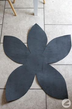 the floor is made out of cement and has a flower on it