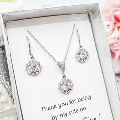 "⚠️⚠️⚠️ PLEASE MAKE SURE TO SEE THE PHOTO TO CHOOSE WHICH MESSAGE CARD NUMBER (#1-30) YOU WOULD LIKE ⚠️⚠️⚠️ SPECIFICATIONS: ♠ For Earrings * Length : 7/8\" (2.2 cm) * Metal Type : Copper + Rhodium Plated * Material : Cubic Zirconia * The parts that we use to make this jewelry are made from Korea. ♠ For Necklace * Pendant Length : 11/16\" (1.8 cm) * Metal Type : Copper + Rhodium Plated * Material : Cubic Zirconia * Necklace Chain Approx. 16\" + 2\" Extension * The parts that we use to make this j Silver Drop Earrings Jewelry Set For Gift, Jewelry With Matching Round Pendant Earrings For Wedding, Matching Earrings With Round Pendant For Wedding, Silver Cubic Zirconia Jewelry For Bridesmaids, Crystal Dangle Jewelry For Bridesmaid Gift, White Hypoallergenic Earrings For Bridesmaid Gift, Silver Cubic Zirconia Bridesmaid Jewelry, Cubic Zirconia Teardrop Jewelry For Bridesmaid Gift, Sterling Silver Matching Earrings For Bridesmaid Gift