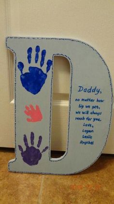 the letter d is decorated with handprints for dad's birthday gifts on pinterest