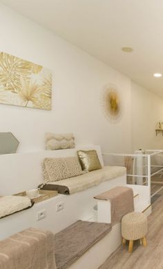 a living room filled with furniture and white walls