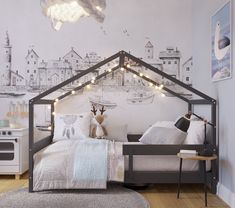 a child's bedroom with a bed and lights on the wall