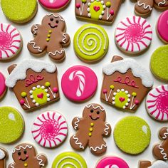 many decorated cookies are displayed on a white surface