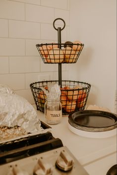 some food is sitting on top of a counter in a room with white tile walls