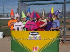 a group of children in party hats posing for a photo