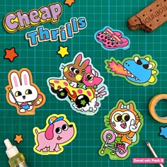 various stickers on a green surface with scissors and other items next to the words cheap things