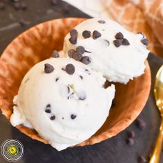 two scoops of ice cream with chocolate chips on top