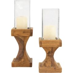 two wooden candlesticks with clear glass holders on each side, set against a white background