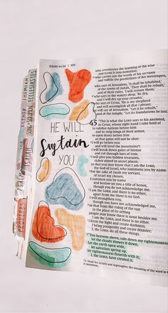 an open bible with the words he will suttain you written in different colors