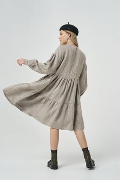 This beautiful linen derss has loose A-silhouette and just below the knee length. It has long sleeves, hidden pockets and classical boat neckline as well as flared, flowy skirt that moves beautifully when you move. This dress can be transformed and look differently with different accessories. If you want a relaxed, comfy appearance, wear it with sandals or sporty shoes. If you want to wear this loose maxi dress to some semi-formal event or some evening party - choose heels, jewelry and put some Chic Long Sleeve Beige Linen Dress, Chic Beige Linen Long Sleeve Dress, Beige Linen Long Sleeve Dress For Fall, Beige Linen Dress For Fall, Beige Linen Fall Dress, Chic Long Sleeve Linen Dress With Pockets, Linen Long Sleeve Midi Dress With Pockets, Long Sleeve Linen Midi Dress For Fall, Long Sleeve Linen Midi Dress With Pockets