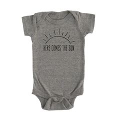 Here comes the sun. Brighten up your little one with this onesie!Product Info Unisex Fit: See size chart in product images for more details. Measurements can vary up to 1 inch depending on color, material, etc. Cream, Mustard, & Light Grey: 100% Organic Unbleached Cotton // Made in the USA // No harmful chemicals, pesticides, or artificial dyes Mauve and Heather Olive: 25% soft airlume cotton, 25% rayon, 50% polyester (These are lighter weight vs. our 100% cotton options) Apparel Care Instructio Sun Onesie, Gardening Apron, Here Comes The Sun, Organic Colors, Fall Kids, Adulting Shirts, Autumn Sales, Pesticides, Reusable Bags