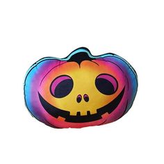 a colorful pumpkin shaped pillow on a white background