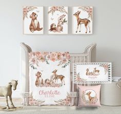 a baby crib bedding set with pink flowers and deer prints on the wall