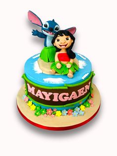 a birthday cake with a cartoon character on top