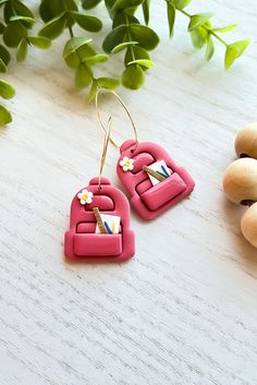 These polymer clay school backpack hoop or dangle earrings are perfect for students and teachers. Handmade from polymer clay, each earring features a pink school backpack with realistic details. These earrings are lightweight and comfortable to wear, and the 18k gold plated brass ear wires make them safe for sensitive ears, you may also order them as dangles with an 18K gold plated ball post. They also make a great gift for back to school day. The dimensions of the hoops are 1.33'' x 1.18" x 0.0 Handmade Pink Jewelry For School, Teacher Themes, Unique Products Design, Back To School Gift, School Gift, Gift Teacher, School Backpack, Back To School Gifts, School Gifts